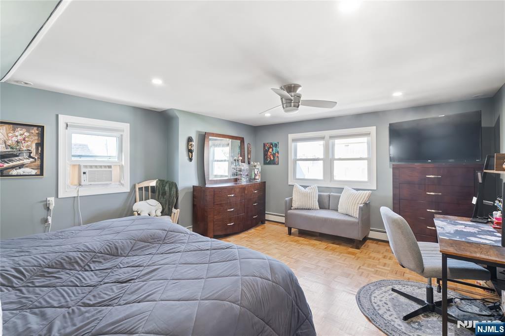 34 William Street Wallington, NJ 07057 - Photo 17 of 26 a bedroom with a bed and a couch