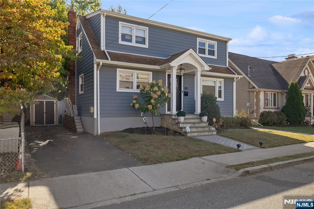 34 William Street Wallington, NJ 07057 - Photo 3 of 26 a front view of a house with garden