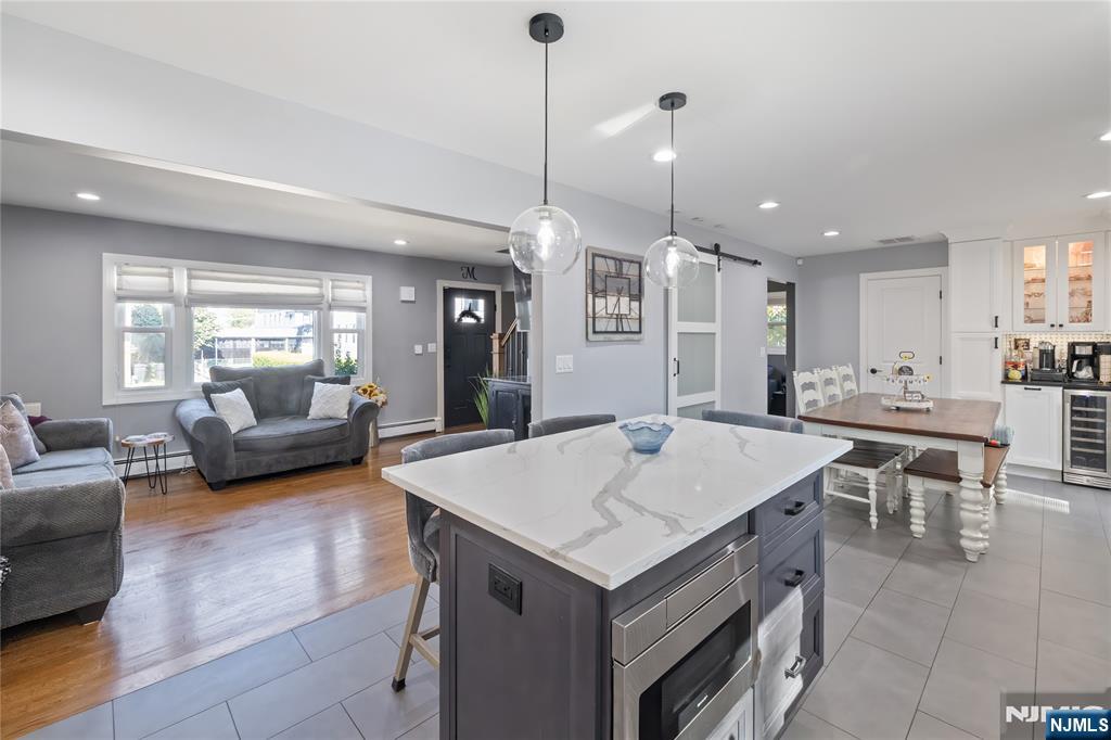 34 William Street Wallington, NJ 07057 - Photo 6 of 26 a large kitchen with a table and chairs