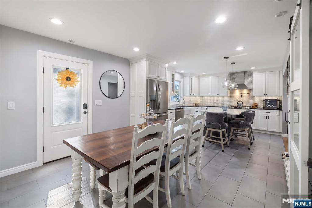 34 William Street Wallington, NJ 07057 - Photo 10 of 26 a large kitchen with a table and chairs