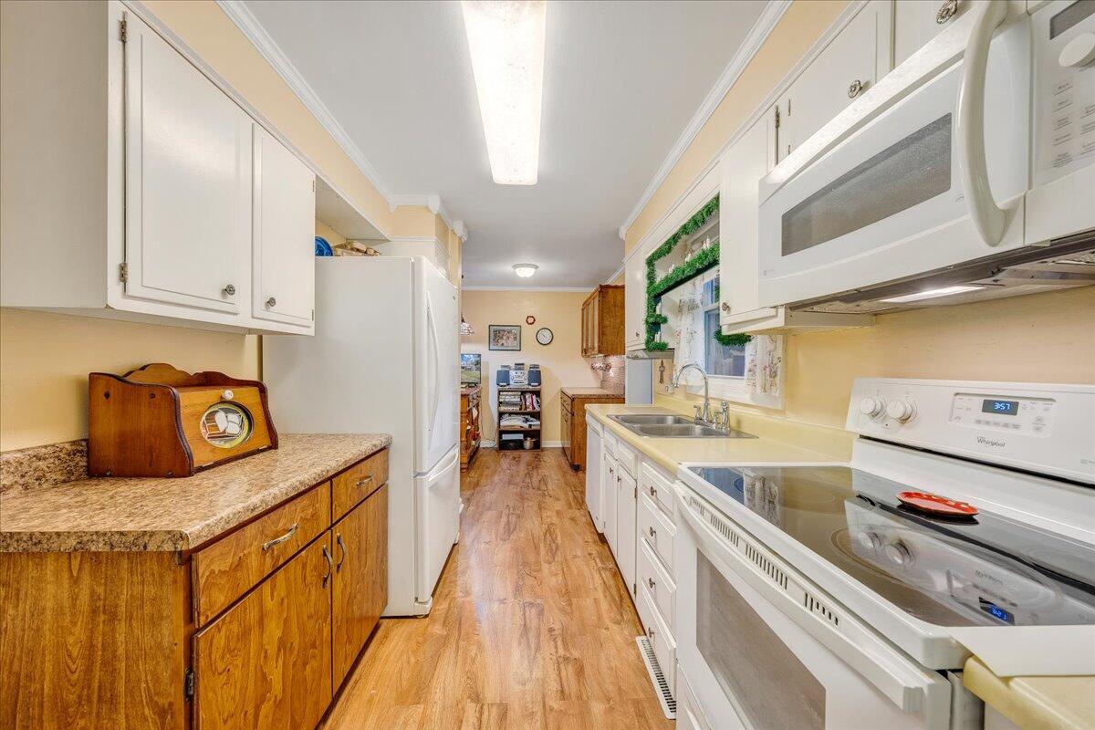 9009 Poor Mountain Road Bent Mountain, VA 24059 - Photo 12 of 30 a kitchen with stainless steel appliances granite countertop a sink and cabinets