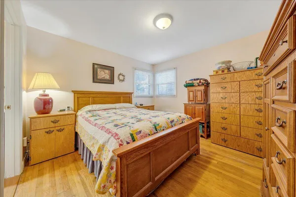 a bedroom with a bed and a dresser