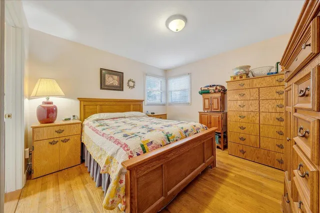 a bedroom with a bed and a dresser