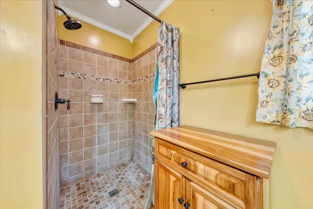 a bathroom with a bathtub and shower