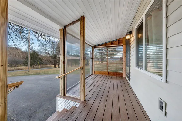 a view of porch with wooden floor and outdoor space