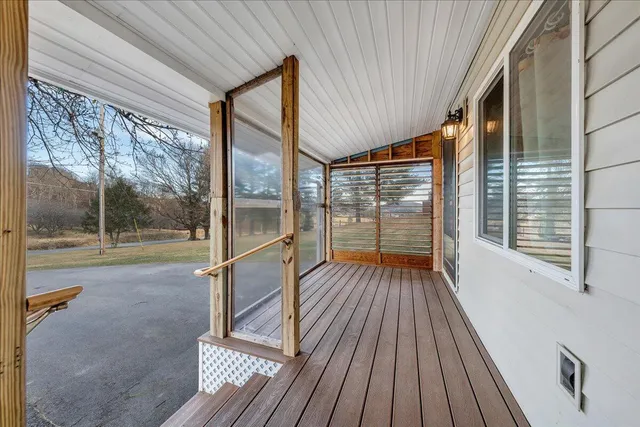 a view of porch with wooden floor and outdoor space