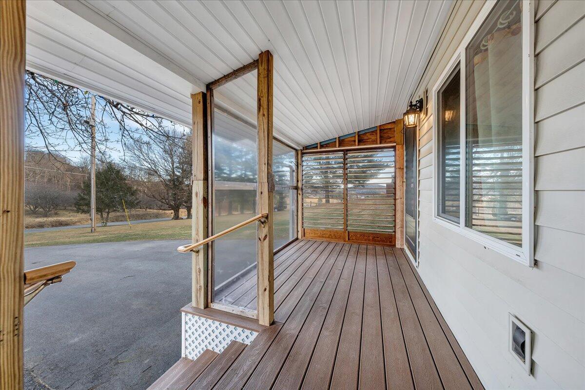 9009 Poor Mountain Road Bent Mountain, VA 24059 - Photo 3 of 30 a view of porch with wooden floor and outdoor space