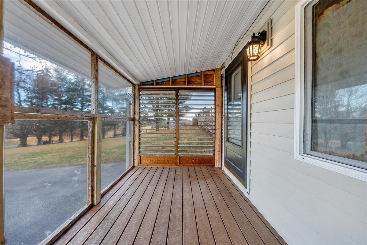 9009 Poor Mountain Road Bent Mountain, VA 24059 - Photo 4 of 30 a view of a porch with wooden floor and outdoor space