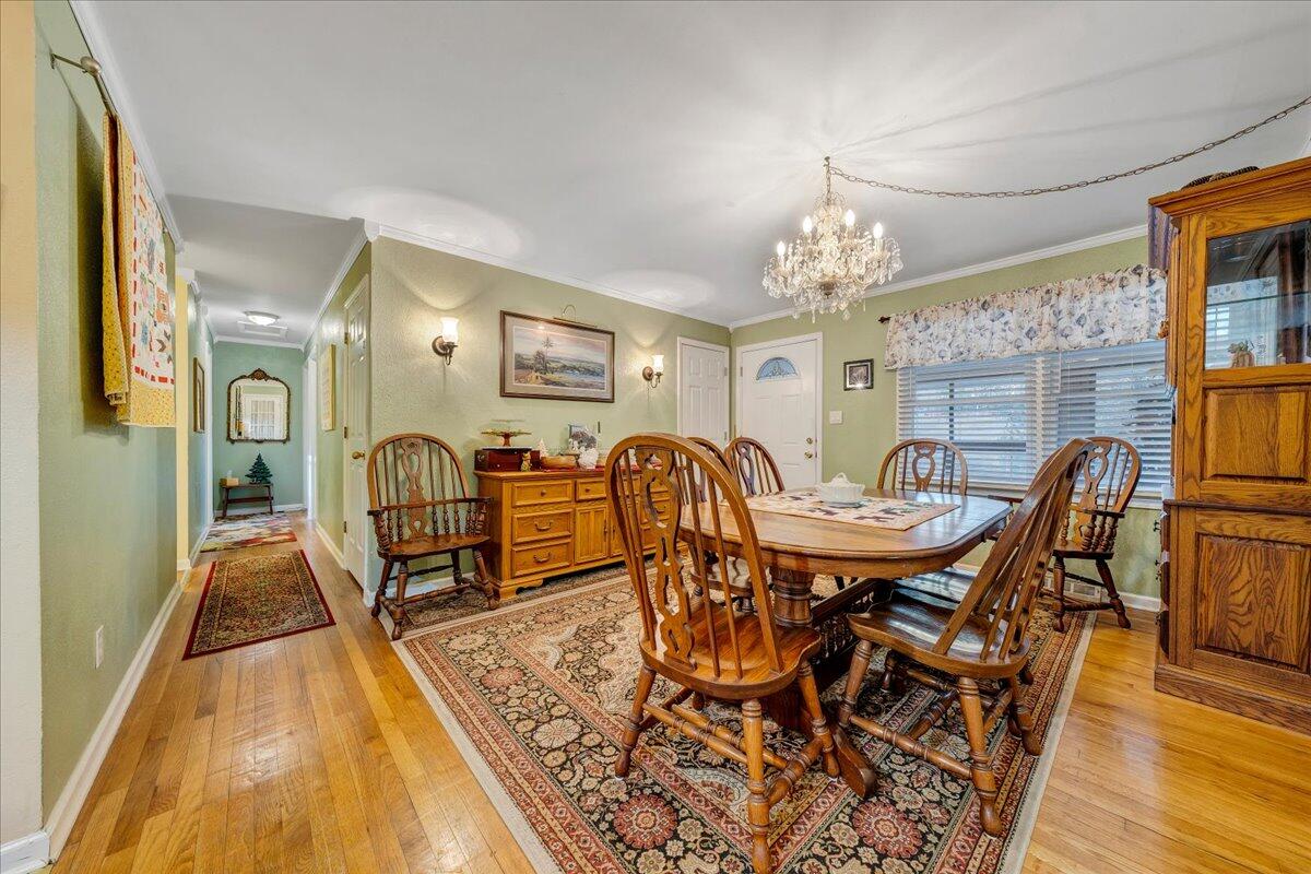 9009 Poor Mountain Road Bent Mountain, VA 24059 - Photo 5 of 30 a view of a dining room with furniture and wooden floor