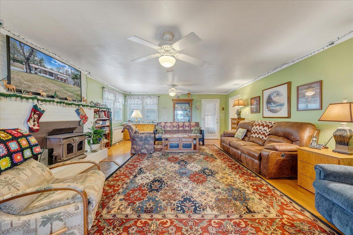 9009 Poor Mountain Road Bent Mountain, VA 24059 - Photo 7 of 30 a bed room with furniture and a chandelier