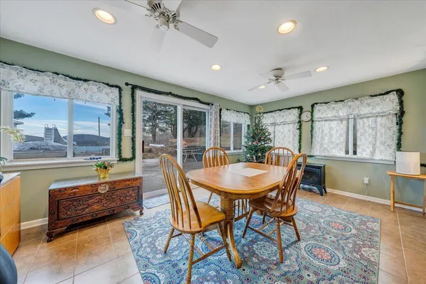 a outdoor dining space with furniture and window
