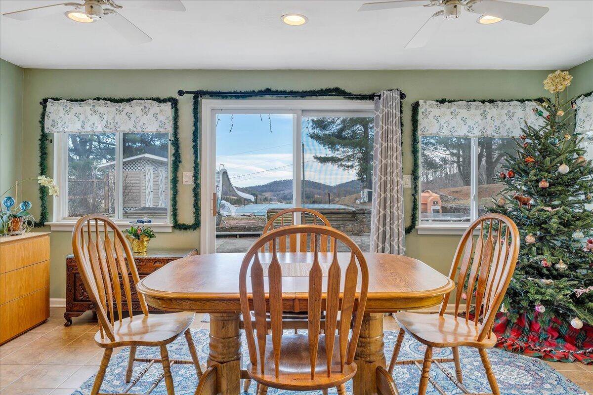 9009 Poor Mountain Road Bent Mountain, VA 24059 - Photo 10 of 30 a view of a dining room with furniture window and outside view