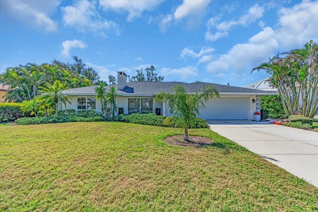 605 Valencia Road Venice, FL 34285 - Photo 1 of 1 a house with garden in front of it