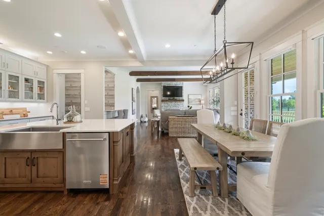 a open kitchen with stainless steel appliances granite countertop a sink stove and refrigerator