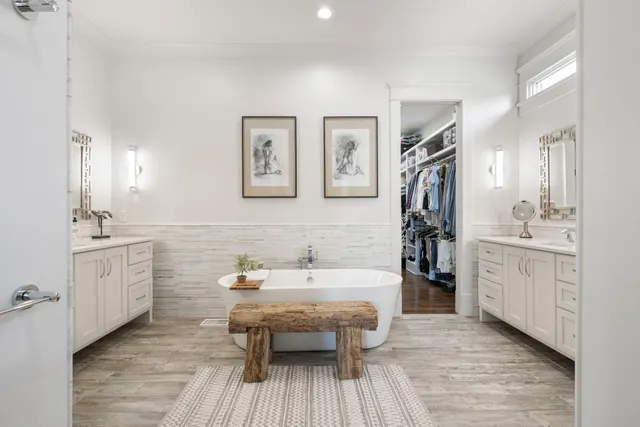 a bathroom with a granite countertop sink a toilet a shower and a mirror