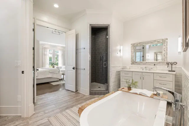 a view of entryway and hall with wooden floor