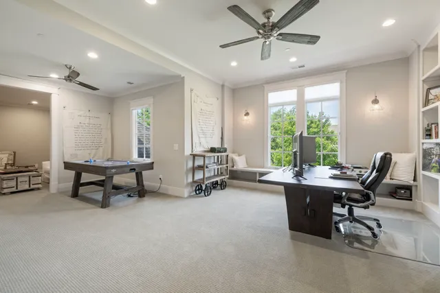 a view of a patio with couches chairs and wooden floor