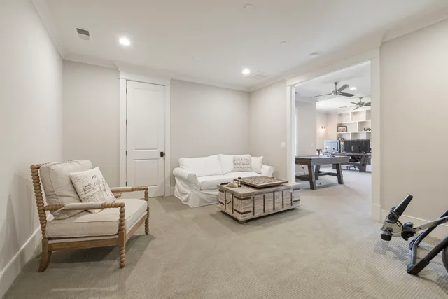 a view of a patio with couches chairs and potted plants