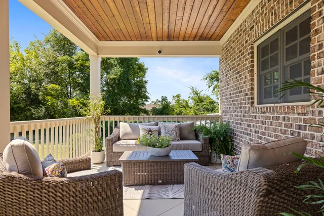 a view of a grassy field with trees