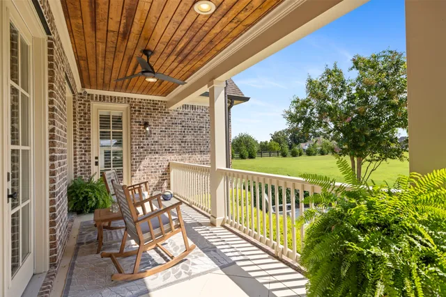 a view of a garden with a building in the background