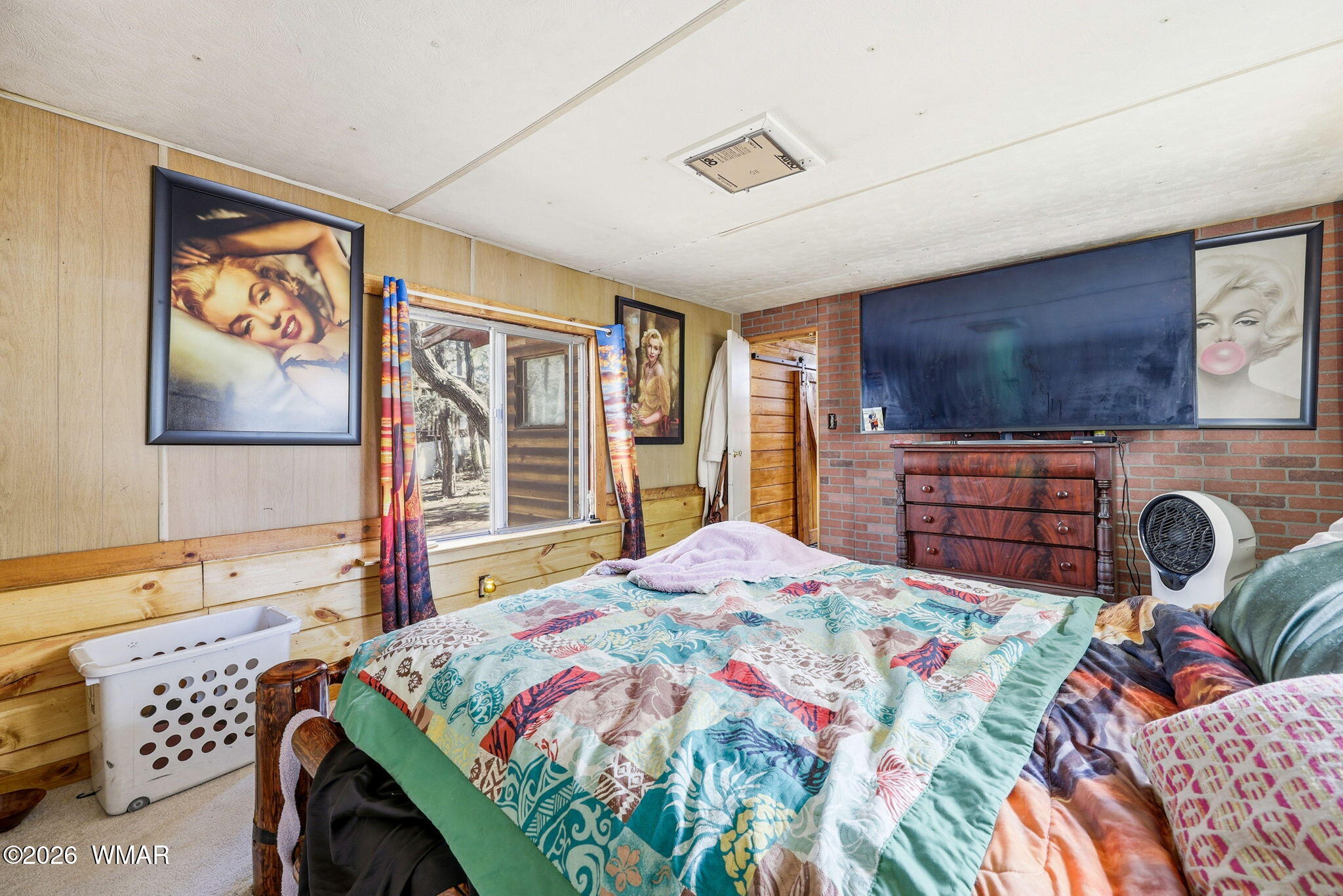 6480 Lower Ridge Drive Lakeside, AZ 85929 - Photo 15 of 32 a bedroom with a bed and a flat screen tv