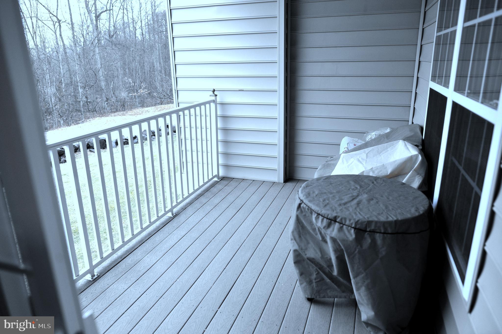 4000 Village Way, Unit 202 Boothwyn, PA 19061 - Photo 14 of 15 a view of a balcony with wooden floor
