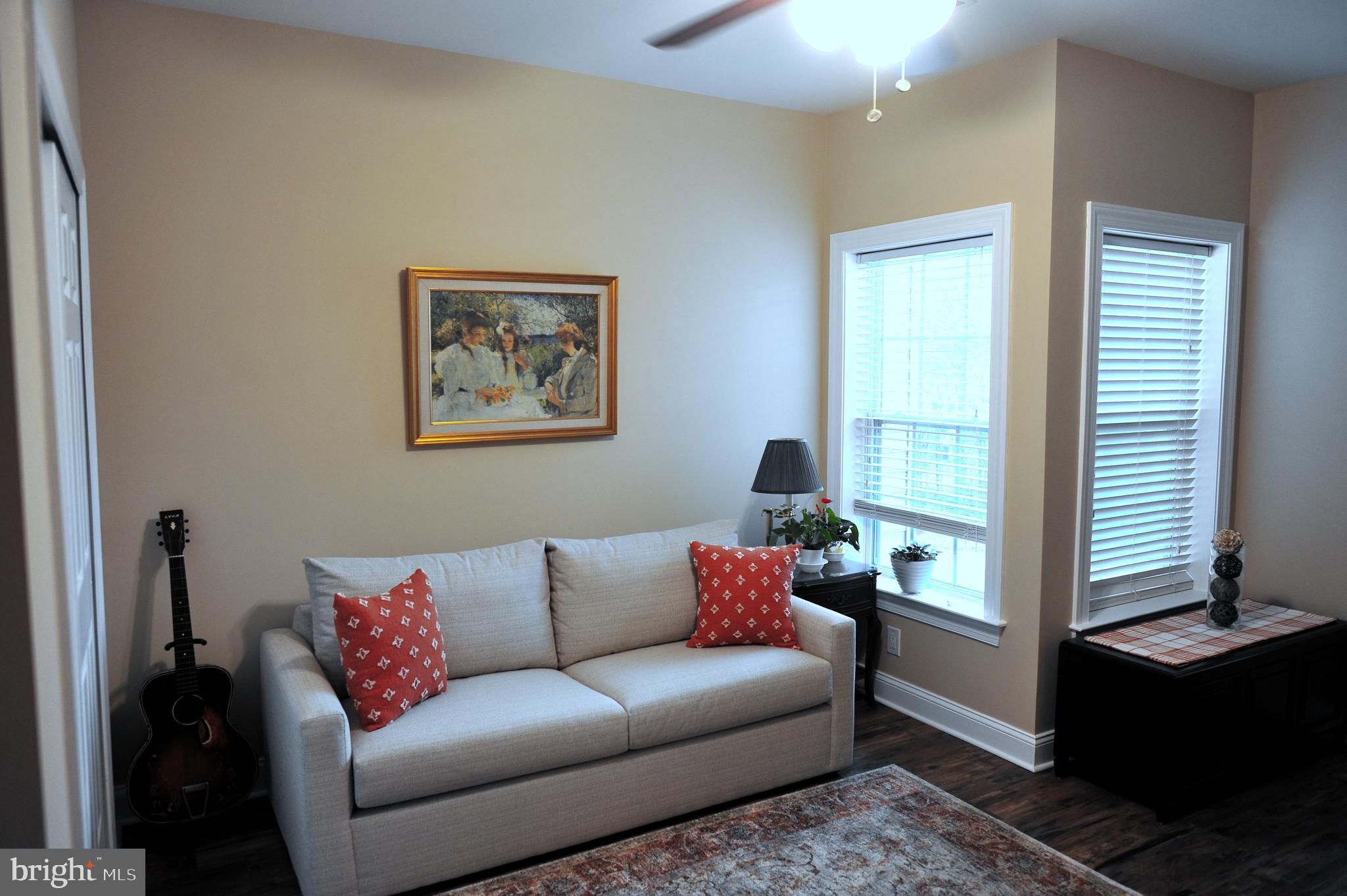 4000 Village Way, Unit 202 Boothwyn, PA 19061 - Photo 10 of 15 a living room with furniture and a window