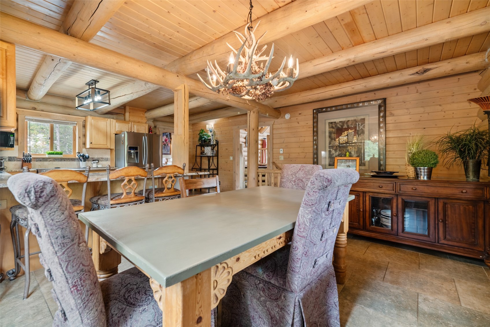 243 Rena Road Breckenridge, CO 80424 - Photo 23 of 50 Tiled dining space featuring beamed ceiling, a chandelier, and wooden ceiling