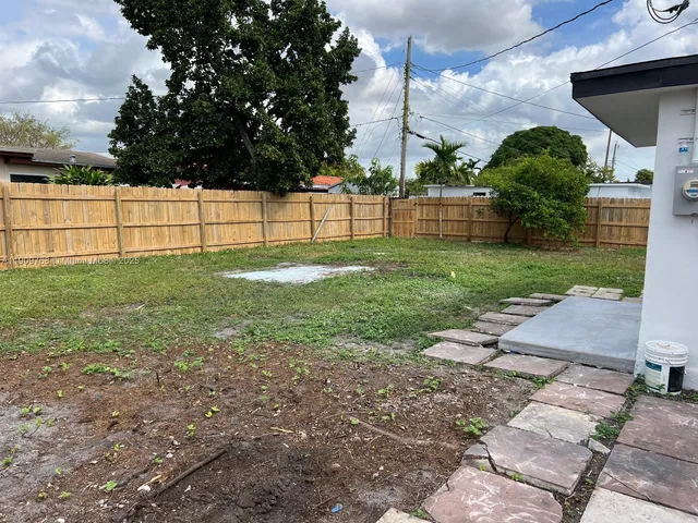 a kitchen with stainless steel appliances a refrigerator and a stove