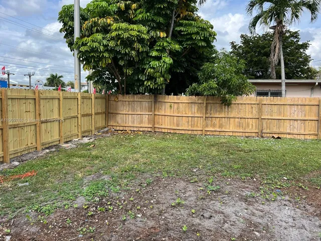 a kitchen with a stove and cabinets