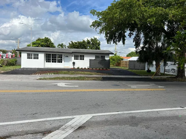 a view of a backyard with a car parked