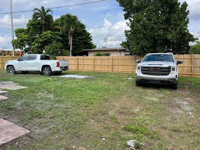 a view of backyard with tree