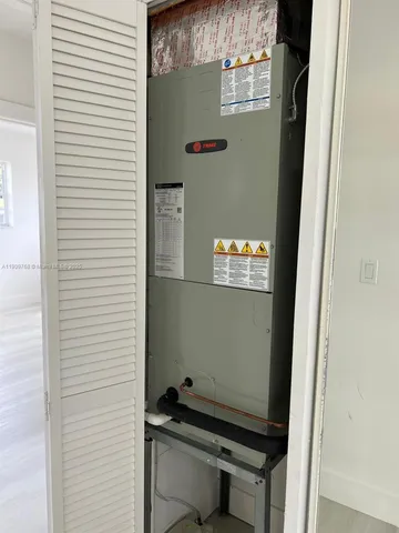 a white toilet sitting next to a white sink