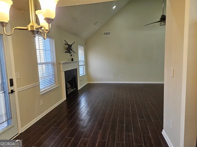 a bathroom with a shower a toilet and a shower