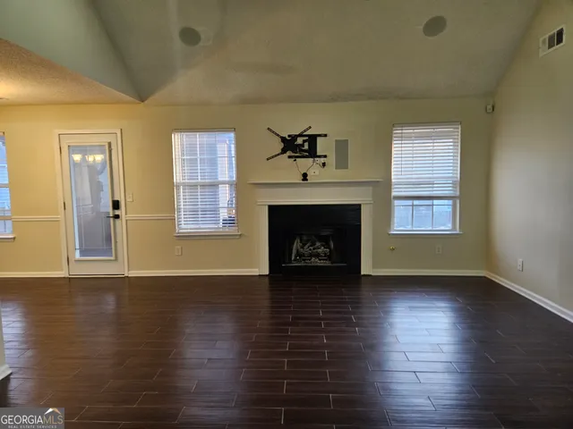 a backyard of a house with yard and garage