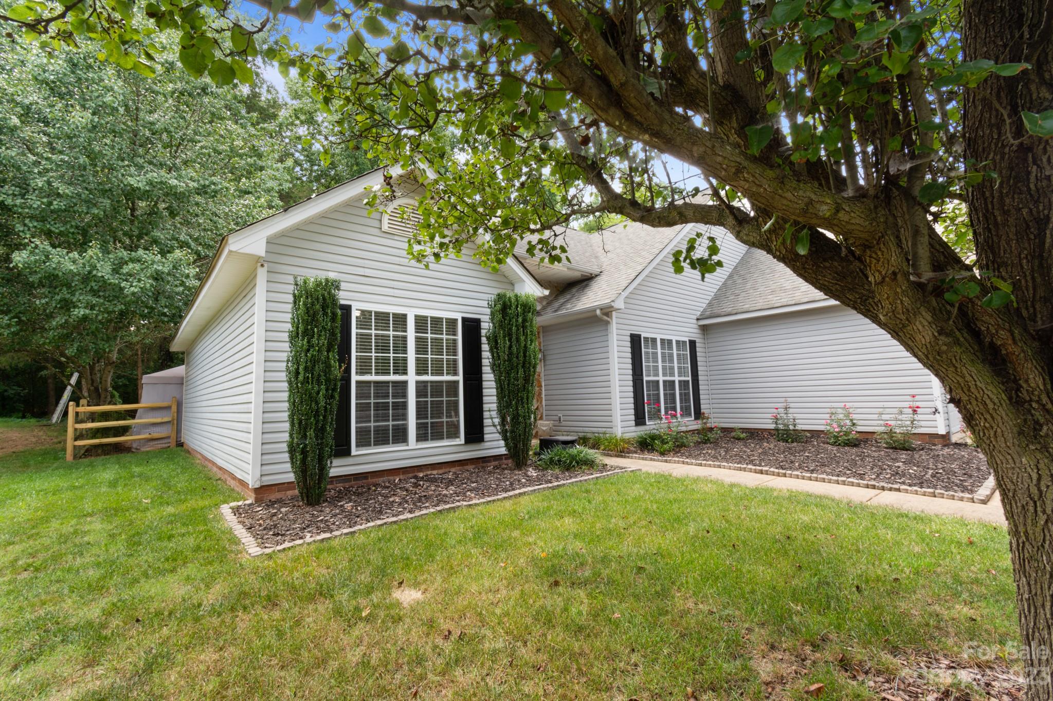 847 Knightsbridge Road Fort Mill, SC 29708 - Photo 3 of 27 a view of a house with a yard potted plants and a large tree