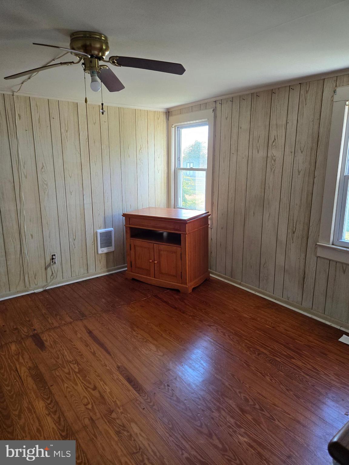 5258 Preston Road Federalsburg, MD 21632 - Photo 10 of 19 wooden floor in an empty room with a window