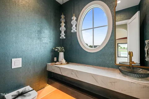 a bathroom with a double vanity sink and a mirror