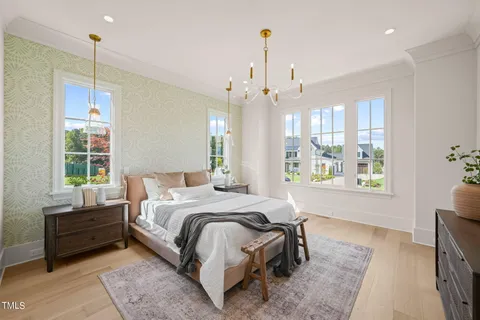 a living room with furniture and large windows