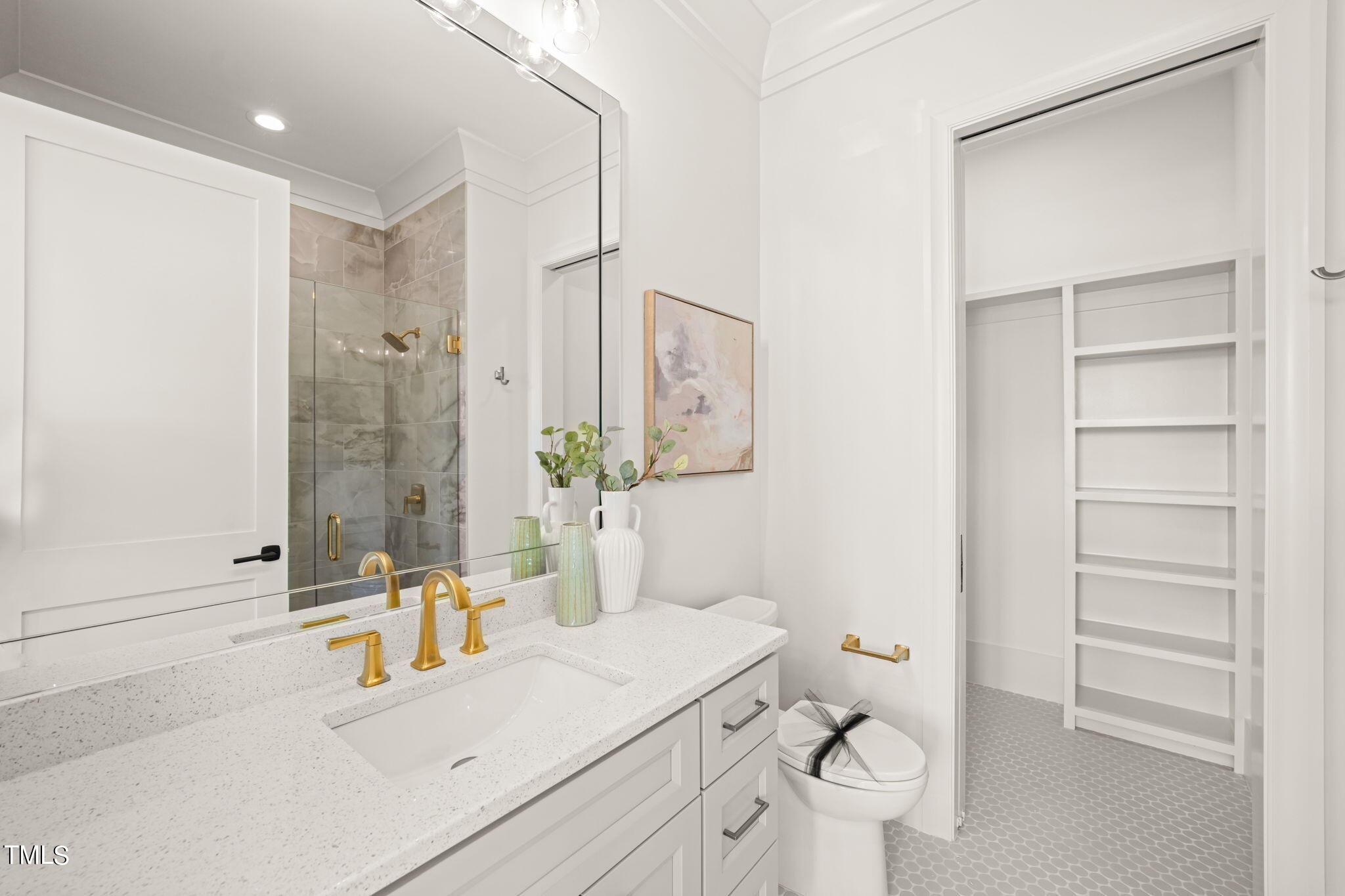 8916 Grand Highland Way Wake Forest, NC 27587 - Photo 34 of 80 a bathroom with a sink a toilet and shower