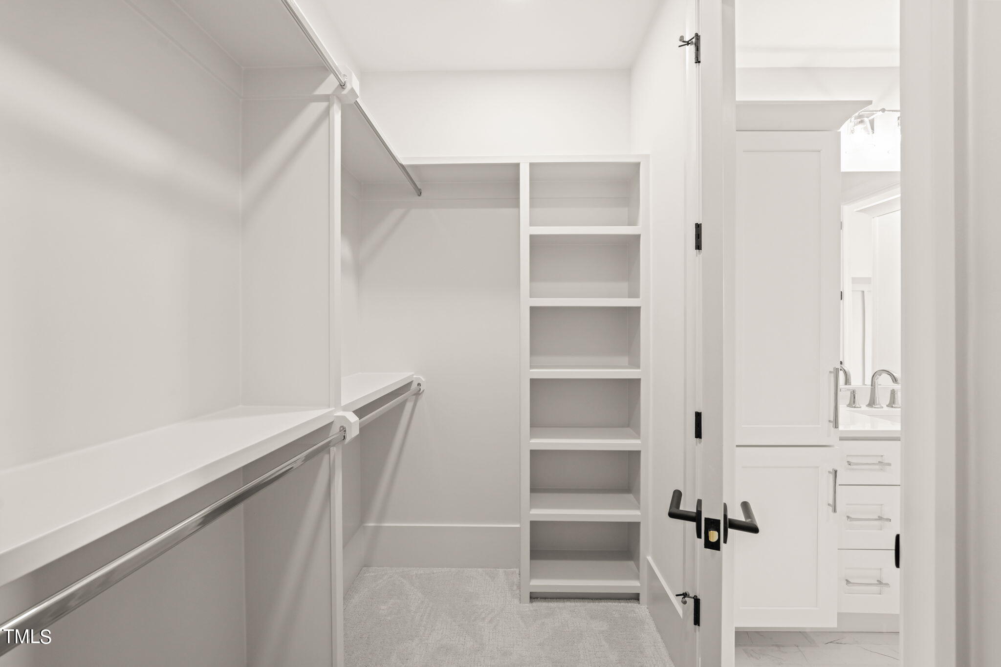 8916 Grand Highland Way Wake Forest, NC 27587 - Photo 47 of 80 a view of walk in closet with empty racks