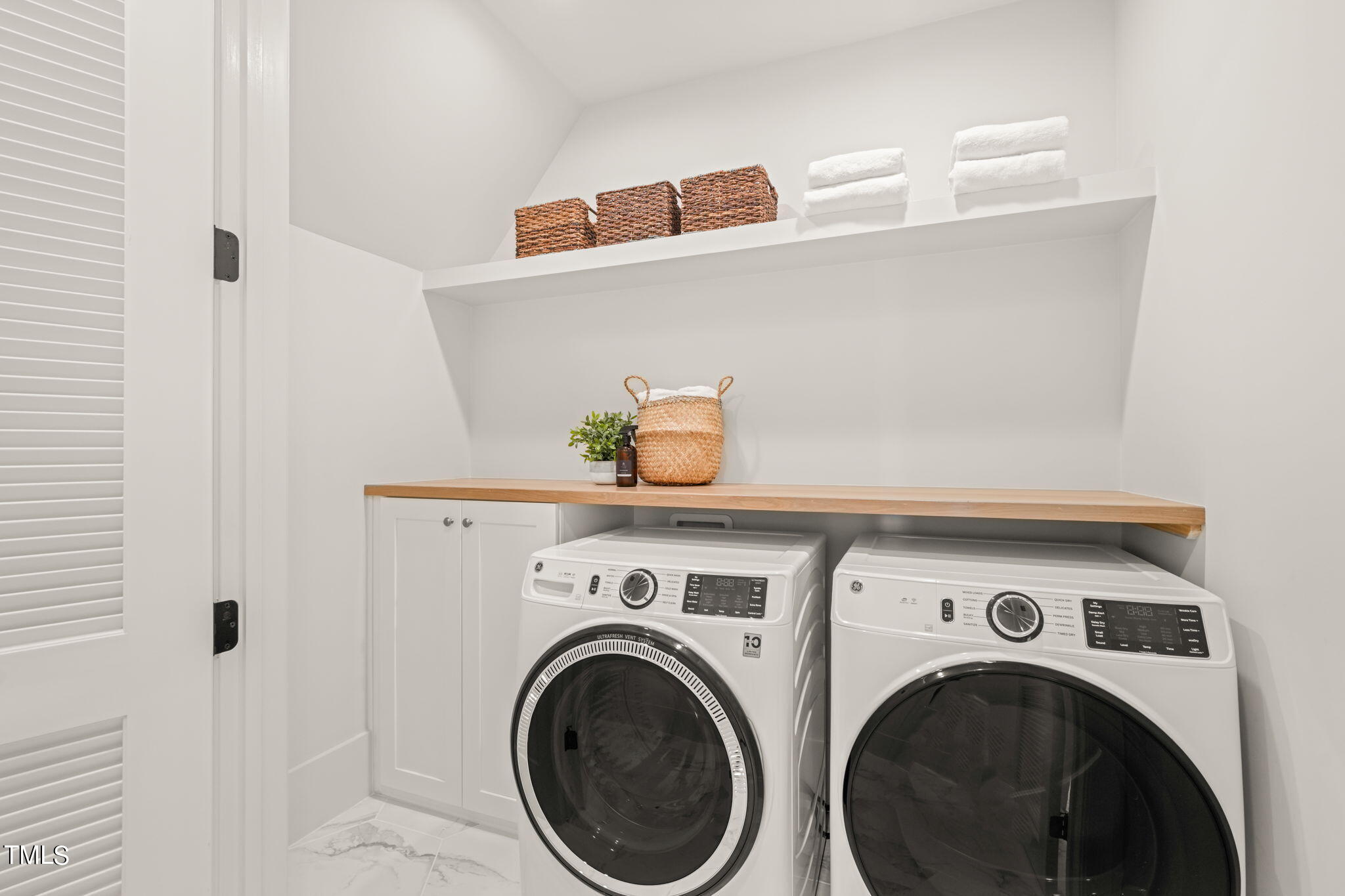 8916 Grand Highland Way Wake Forest, NC 27587 - Photo 55 of 80 a utility room with dryer and washer