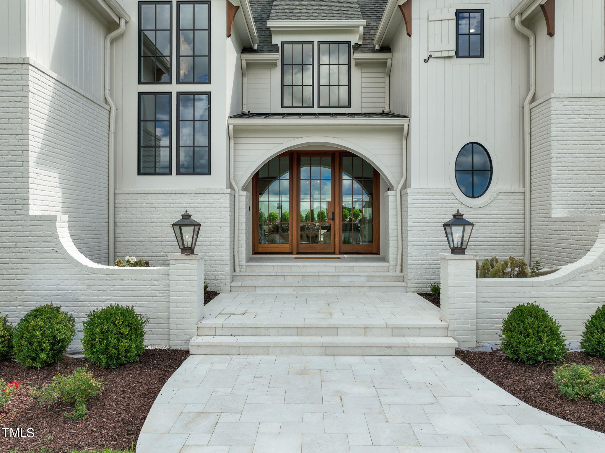 8916 Grand Highland Way Wake Forest, NC 27587 - Photo 6 of 80 a front view of a house with garden