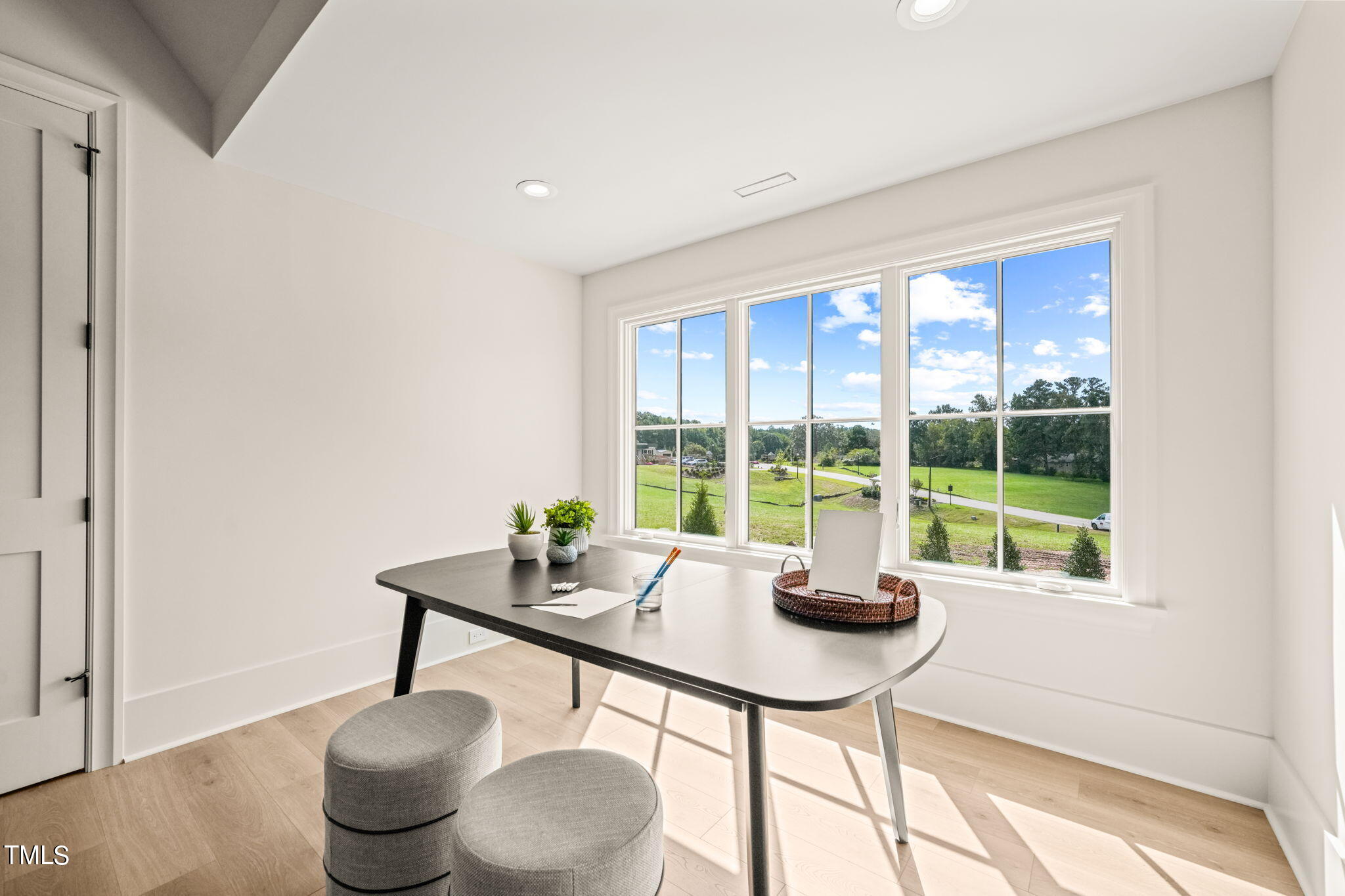 8916 Grand Highland Way Wake Forest, NC 27587 - Photo 62 of 80 a dining room with furniture and a floor to ceiling window