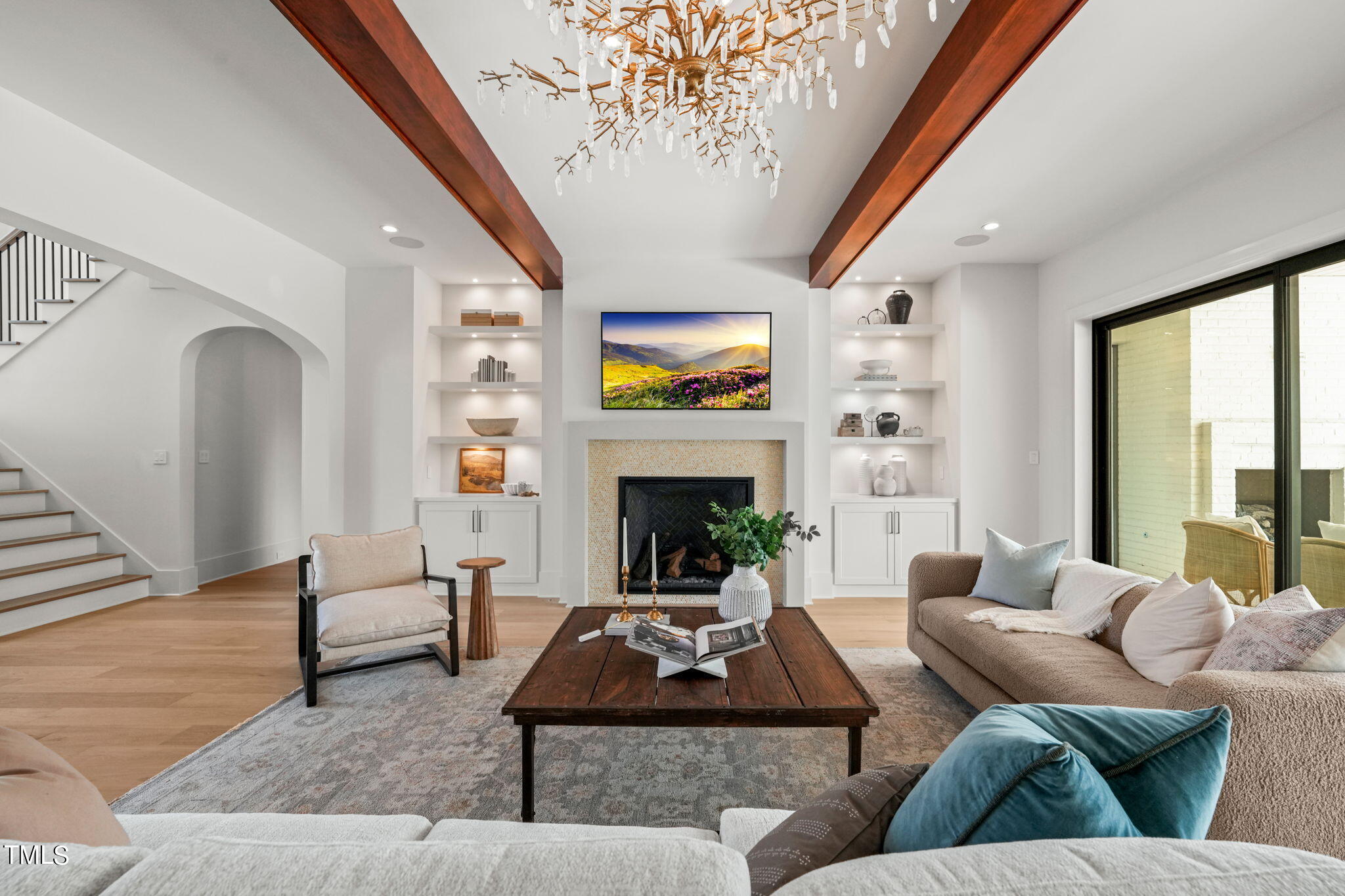 8916 Grand Highland Way Wake Forest, NC 27587 - Photo 9 of 80 a living room with furniture and a fireplace