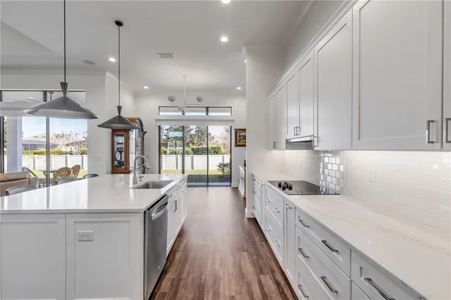 a large bed sitting in a bedroom next to a window