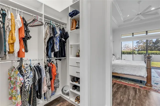 a bedroom with a bed and flat screen tv