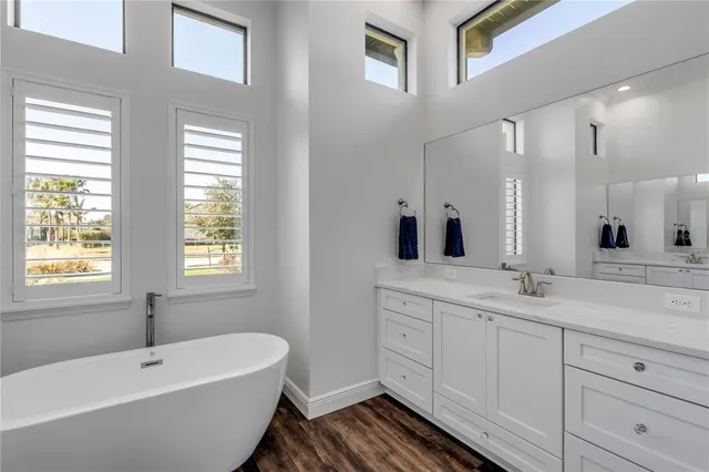 a view of a livingroom with furniture and a ceiling fan