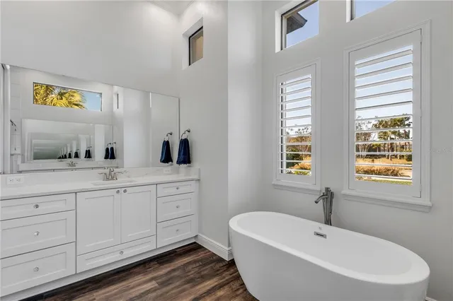 a view of a livingroom with furniture and windows