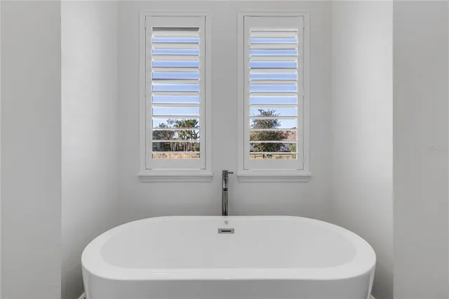 a view of yard with swimming pool and green space